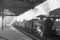 photo R4 ‘Austin Sevens’ still much in evidence 49624 enters Rochdale station shadows down platform on 11th Jan 1960.  RS Greenwood